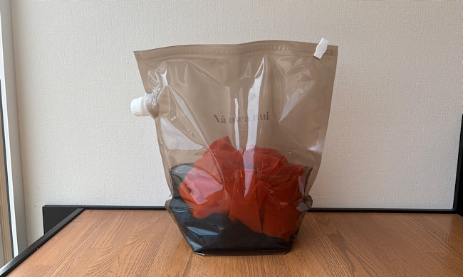 洗濯物が入ったウォッシュバッグ
